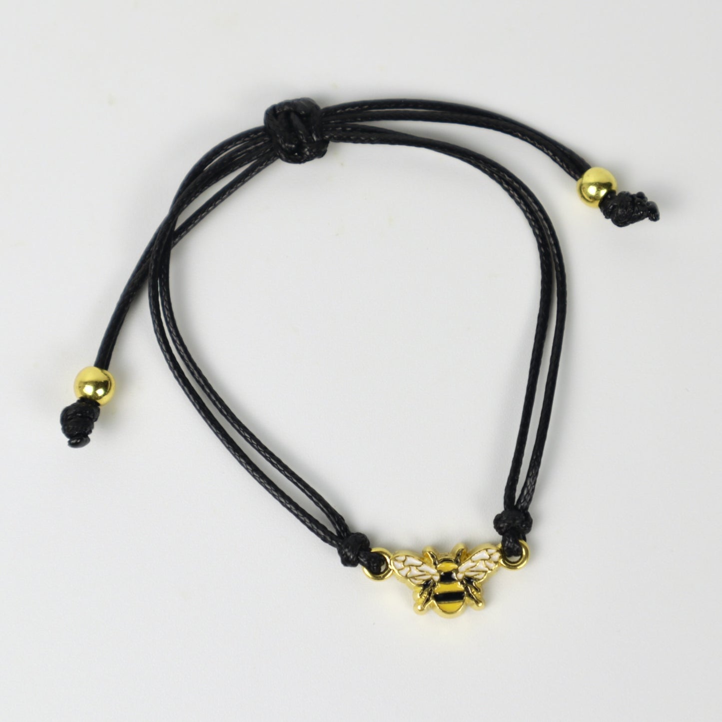 Pulsera con dije de abeja dorada
