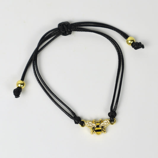 Pulsera con dije de abeja dorada