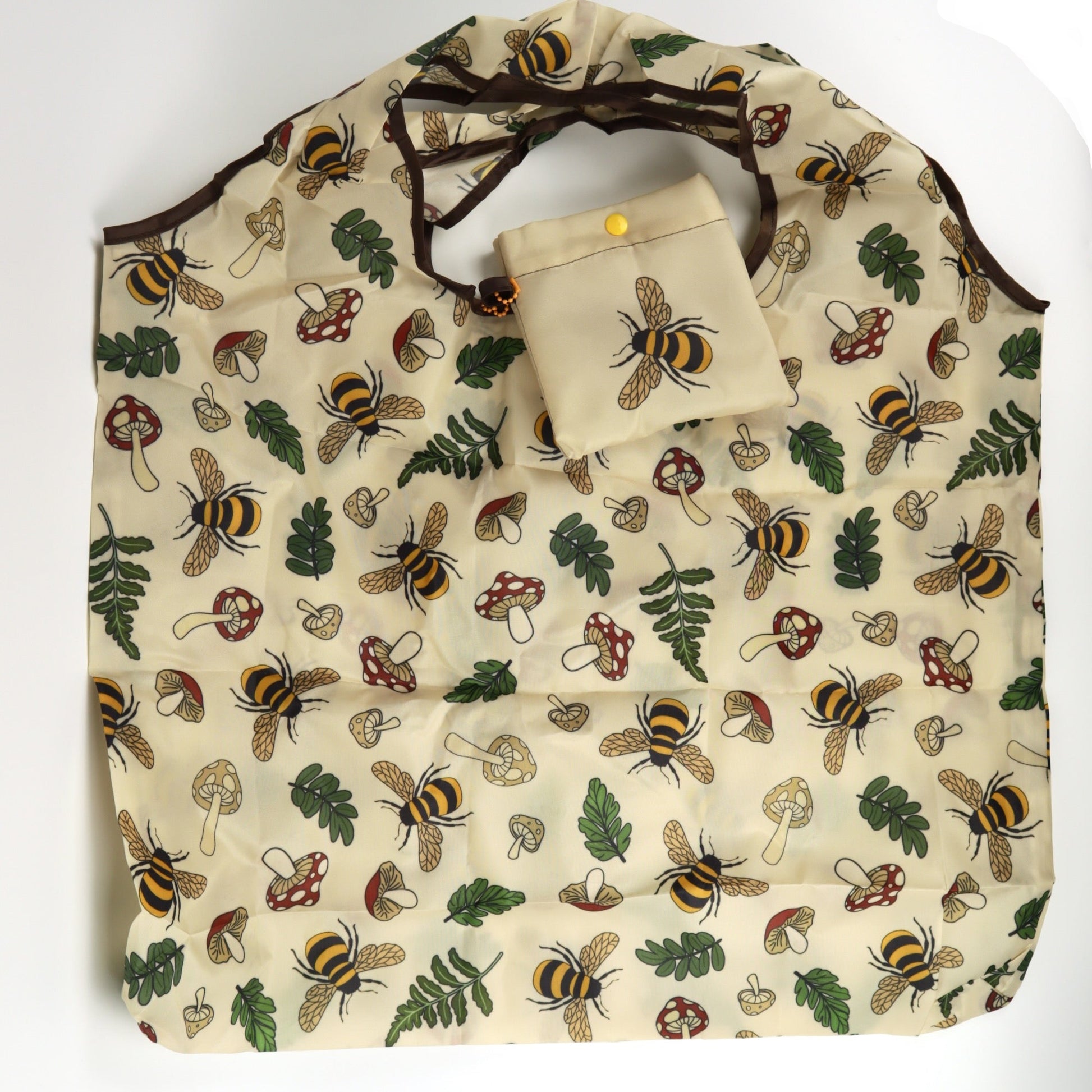 Bees and nature-themed tote bag with matching pouch on a white background
